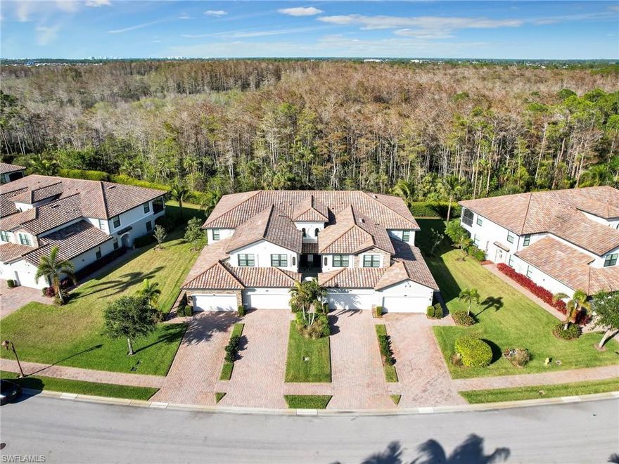 Welcome to this impeccably maintained FIRST FLOOR 3 bedroom, 2 bathroom, 1883 square foot END UNIT coach home with attached 2 CAR GARAGE in the highly sought-after Casoria subdivision of the exclusive gated community Treviso Bay. SOCIAL MEMBERSHIP INCLUDED! This TURNKEY FURNISHED unit (by Gouse's Fine Furniture) offers the perfect blend of comfort, style, and luxury, making it an ideal full-time residence or seasonal retreat. Upon entering, you will be greeted by an open and airy split-bedroom floor plan, with pocket doors separating the 2 guest bedrooms and guest bathroom which ensures ample space for family and visitors. The grand great room provides plenty of space for dining & entertaining and offers crown molding as an elegant touch. The kitchen features a breakfast bar, eat-in kitchen, walk-in pantry, and plenty of cabinet & counter space. The sliders off the living area flow effortlessly to the spacious screened lanai with wood look plank tile flooring, where you'll enjoy peaceful views of the Rookery Bay Preserve—a perfect spot for relaxing or entertaining. Sliders also lead into the oversized primary suite which offers crown molding, 2 walk-in closets, an en-suite bathroom with dual sinks, upgraded shower head, and a separate tub & shower. HURRICANE IMPACT WINDOWS provide peace of mind and convenience. This home also features a laundry room plus utility sink in the garage. The driveway is also extra long providing plenty of space for guests to park. The condo was newly repainted 1 year ago in a neutral color. Treviso Bay’s resort-style amenities are second to none. Enjoy a full range of activities including: a 18-hole championship golf course designed by Arthur Hills (social members can golf May-Oct), 8 lighted Har-Tru tennis courts with a tennis center & pro shop, bocce courts, basketball courts, and pickleball courts for active outdoor fun. Residents enjoy 2 private clubhouses—the 64,000 sq ft main clubhouse with fine dining, library, card rooms, billiard room, and 15,000 sq ft Villa Rilassare, with a poolside bar and restaurant, fitness amenities including a fitness center, pilates and aerobics studio, and full-service spa with a beauty salon and sauna. There are multiple pools including a resort pool, kids pool, and lap pool. Always a multitude of social activities available for all interests! Treviso Bay offers 24-hour guard at the gate for additional security and is ideally located near the best of downtown Naples, including shopping, dining, and entertainment options. With its exceptional amenities and prime location, this move-in ready condo provides the perfect opportunity to live the life you've always dreamed of in Treviso Bay!