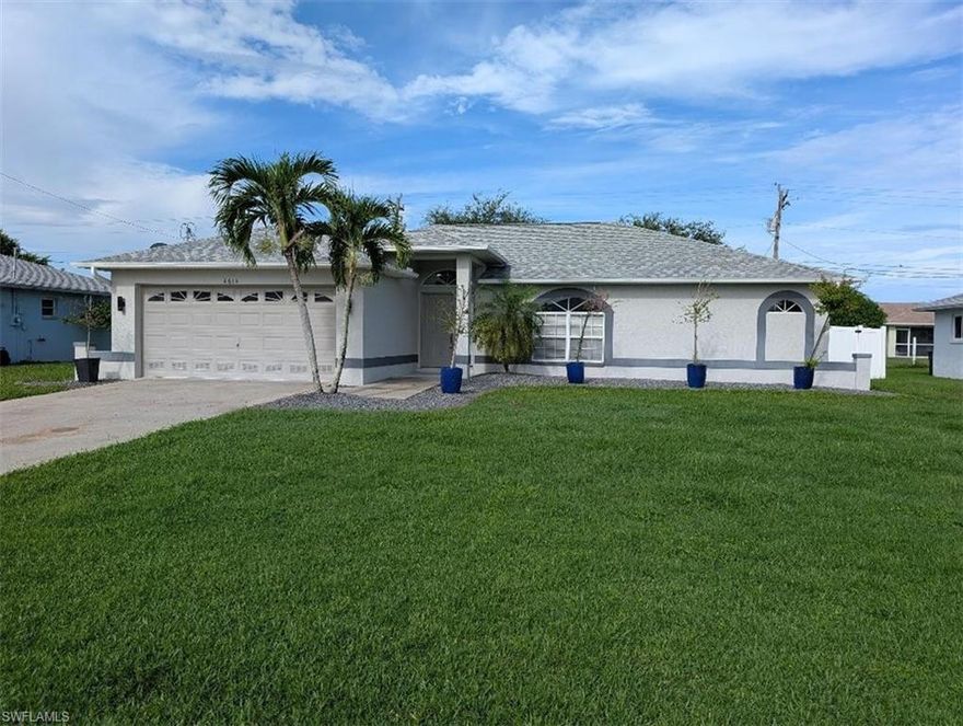 Beautiful home in SW area.  Totally remodeled with laminate floors throughout.  Large kitchen with white shaker cabinets and stainless steel appliances.  Completely fenced yard and large screened lanai.  Walking distance to shopping and restaurants.
