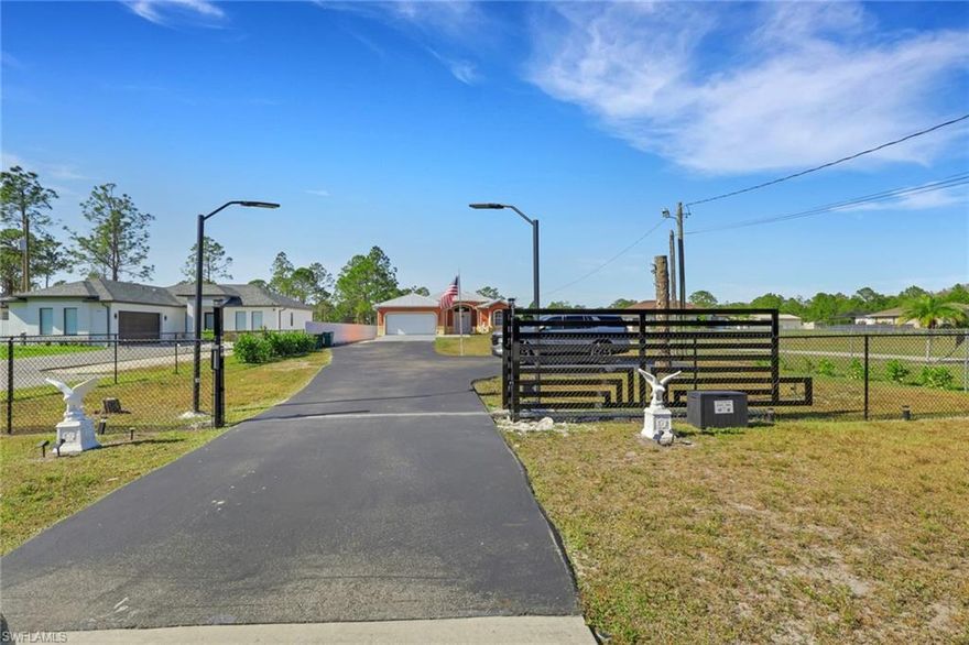 This beautiful home features a 2023 metal roof, 3 bedrooms, and 2 bathrooms on 1.17 fenced and gated acres. Enjoy outdoor living with a spacious outdoor kitchen, offering privacy, durability, and plenty of room to relax or entertain.