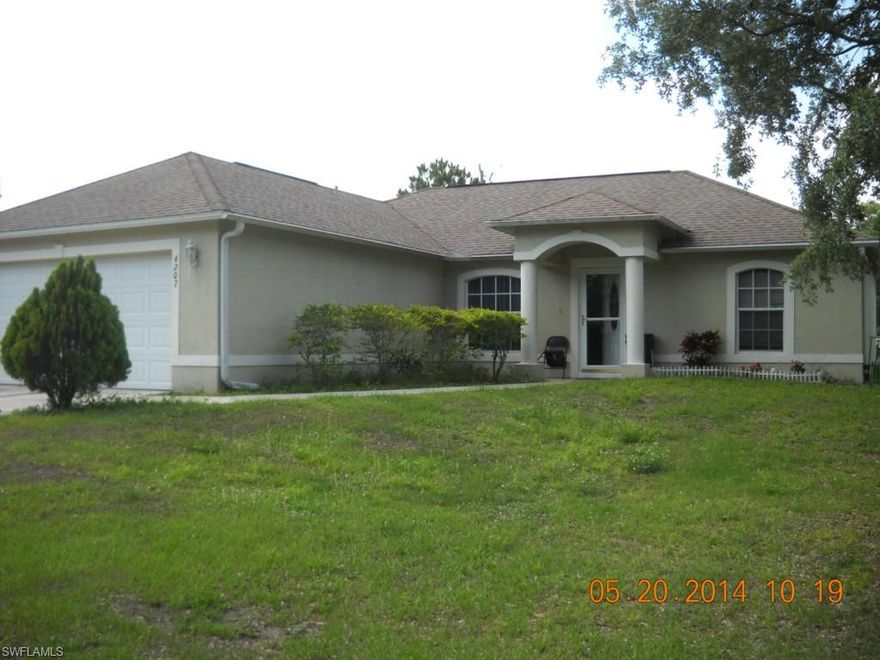Charming 3 bedroom 2 bath CBS built home in the center of Lehigh Acres close to shopping and services. Wonderful open floor plan with ceramic tile flooring, you can see the entire Great Room from the kitchen. Do you like to entertain? You can cook and entertain guests at the same time! Comfortable screened in Lanai with a doggie door. Cool breezes make this a great selection for a home. Kitchen appliances; refrigerator, dishwasher, microwave and range are in place. Water system is new! Call now for a private showing.