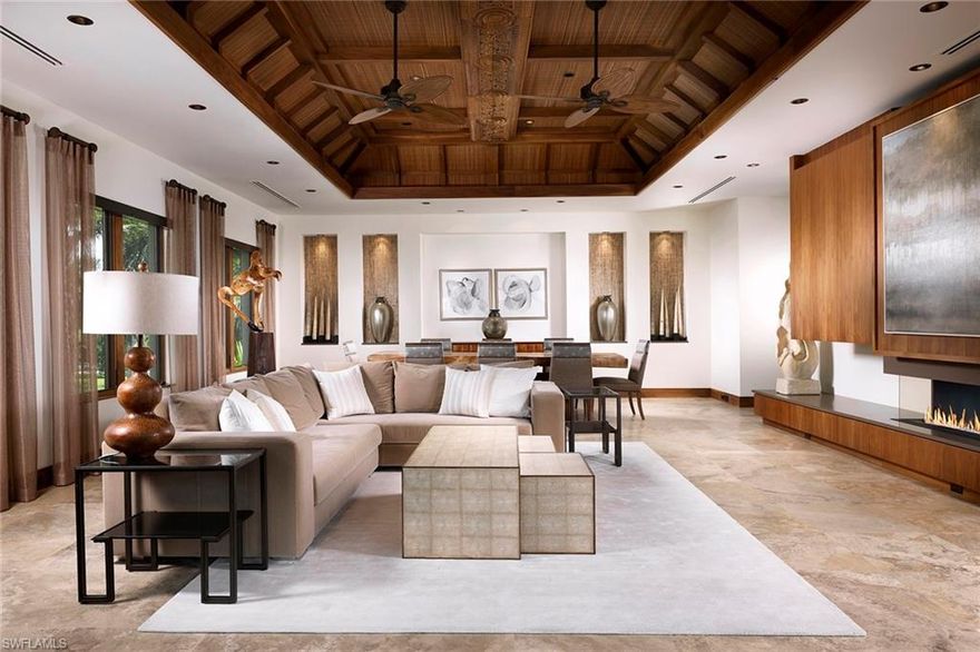 Ideally located one block to the beach and two blocks from Third Street, Namaste was designed to provide a calm and relaxing atmosphere to all. Offering quality craftsmanship and exquisite materials, the earthy and organic tones blend perfectly with the hand-selected Thai and Balinese finishes throughout.  The gourmet kitchen highlighted by the handmade tin water lily medallions from Thailand has a soft view of the lush greenery surrounding. Separated only by the custom gemstone Quartz and agate wet bar area lies the peaceful great room area surrounded by windows letting in the natural light. The tranquil master suite is a sanctuary, providing views through the western facing balcony and an airy place to unwind.  Truly one of a kind, the rooftop of this spectacular estate provides a great locale for family and friends to enjoy sunrises, sunsets over the Gulf or the occasional Naples firework show.  Not to be outdone, the southwest facing lanai includes a vanishing edge saltwater pool and a spacious covered area.  Beautifully surrounded by lush landscaping filled with fruit trees, coconut palms, orchids and jasmine flawlessly finish the experience that is Namaste.