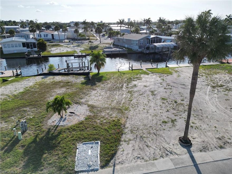 Prior to hurricane Ian, there were only two vacant lots in all of Bayside Estates.  That fateful day changed everything.  Many homeowners demolished their homes and put their lots up for sale and many of those vacant lots have since changed hands and the new owners currently are, or will be, bringing in new manufactured homes and placing them onto the lot they purchased.  It seems like a new manufactured home arrives every week or so.  It won't be too much longer and will be back to pre-hurricane status.  Therefore, if you have considered purchasing a Bayside Estates lot, there is still a good selection to choose from.  However, inventory has been reduced.  Now may be the best time to find that special Bayside lot and make it yours.  Come see this lot today and don't be shy, make an offer!!.       
Bayside Estates is the best kept secret of Fort Myers Beach. This incredibly active and friendly 55+ community is the crown jewel on the gulf coast. Bayside estates is only 2.5 miles to the beach and is accessible by either car or boat--right from either your driveway or private boat dock. A very popular activity is riding your electric bicycles to the beach for the day and visit the world-famous Jimmy Buffett’s Margaritaville. Just don't step on a pop-top!!. Nearly all of the major retail vendors are within a very short driving distance for ultimate convenience. For those who don’t know a lot about Bayside Estates, it is a very fun place to call home---some would even say it’s a mature person’s playground. Whether you want to play pickleball, tennis or bocce ball or hang out at the community pool, or simply cruise the hood in your golf cart, there is always something going on around here. People are friendly and you will be warmly welcomed.