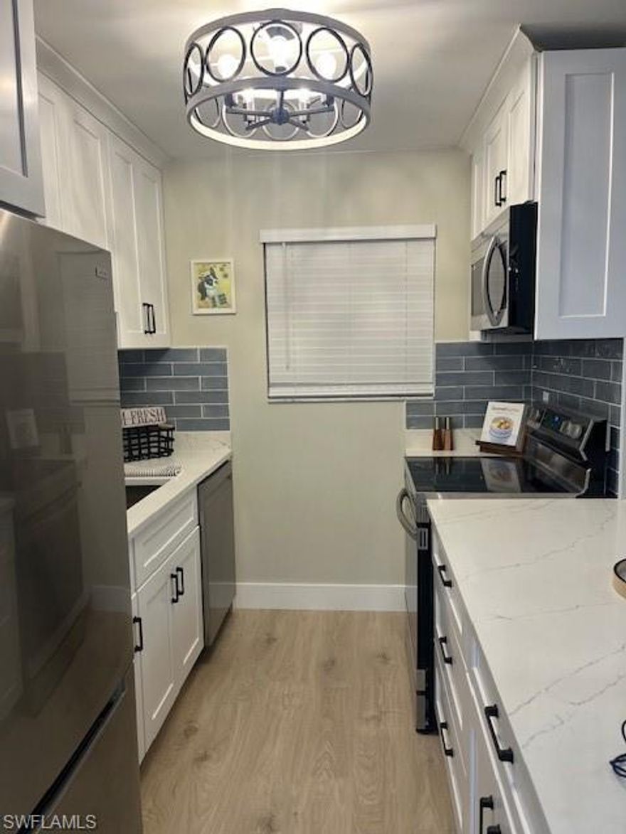 BEAUTIFULLY COMPLETELY RENOVATED TOWNHOME IN PROVINCETOWN, Fort Myers — the nicest UPDATED unit in the community. Everything is brand new and never used, with a completely open kitchen featuring the only extended quartz island in the neighborhood. All-white shaker cabinets, all-new Samsung stainless steel appliances, three shaker glass pantry barn door, a beautiful blue backsplash, crown molding, a new garbage disposal, brand-new water heater. Barn doors on every closet.  All new flooring and subfloor with upgraded insulation. Master and guest bathrooms remodeled with premium finishes. New blinds throughout, plus fresh, newly smoothed interior walls and painted.  The exterior building is newly painted in a brand-new, one-of-a-kind color that stands out from the rest. Brand-new, completely rebuilt outside deck — perfect for morning coffee or winding down with a glass of wine. Freshly painted interior garage. Extra storage. Driveway parking plus abundant guest parking. This is truly one of a kind and very tastefully done. Everything is brand new in the unit. You will not find another unit in this caliber inside and out. GATED community with a guard in the heart of town.  inside and out. A MUST SEE

Community features a beautiful, well-kept pool and LOW HOA fees. Located in central Fort Myers, close to Costco, restaurants, medical offices, the beach, Barbara B. Mann Performing Arts Hall, and just over the bridge from Cape Coral. Walking distance to Florida State University (FSU). Never flooded. Ideal for first-time buyers

HOA: Low fees
Flood Zone: Never Flooded
Parking: Driveway + guest parking
Location perks: Central Fort Myers, near Costco, dining, medical, beaches, arts hall, Cape Coral bridge; walking distance to FSW
Inclusions: Samsung stainless steel appliances, upgraded fixtures, blinds, fresh paint, and deck space
Exterior: One-of-a-kind color, brand-new deck, extra storage
Interior: Open kitchen with extended quartz island, white shaker cabinets, blue backsplash, crown molding, barn doors, three glass pantry barn door, and new lighting fixtures throughout the entire condo. It is 2 full baths, not 1-1/2.