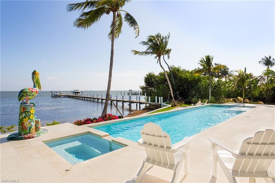 BRAND NEW construction on the bay with unobstructed view across Pine Island Sound toward the east with a private 260ft pier featuring 2 both lifts and a large tanning / entertaining platform. This en vogue Carribean Contemporary leaves you speechless the moment you open the door as your eye is drawn out through the great room with coral rock flooring over the lengthy pool to the expansive views beyond. In the chefs kitchen a refrigeration wall and one of a kind Bahamian Conch and sea-glass countertops are a wow along with the spaciousness and natural light flowing from all directions. The master suite is located on the main level with his and hers baths and a tremendous closet. Up the the natural wide plank oak steps to the guest suites and the studio which is effectively the 5th bedroom and a separate office. The entire home is exceptionally well designed and flows beautifully along with the subtle details which have you smiling from room to room.