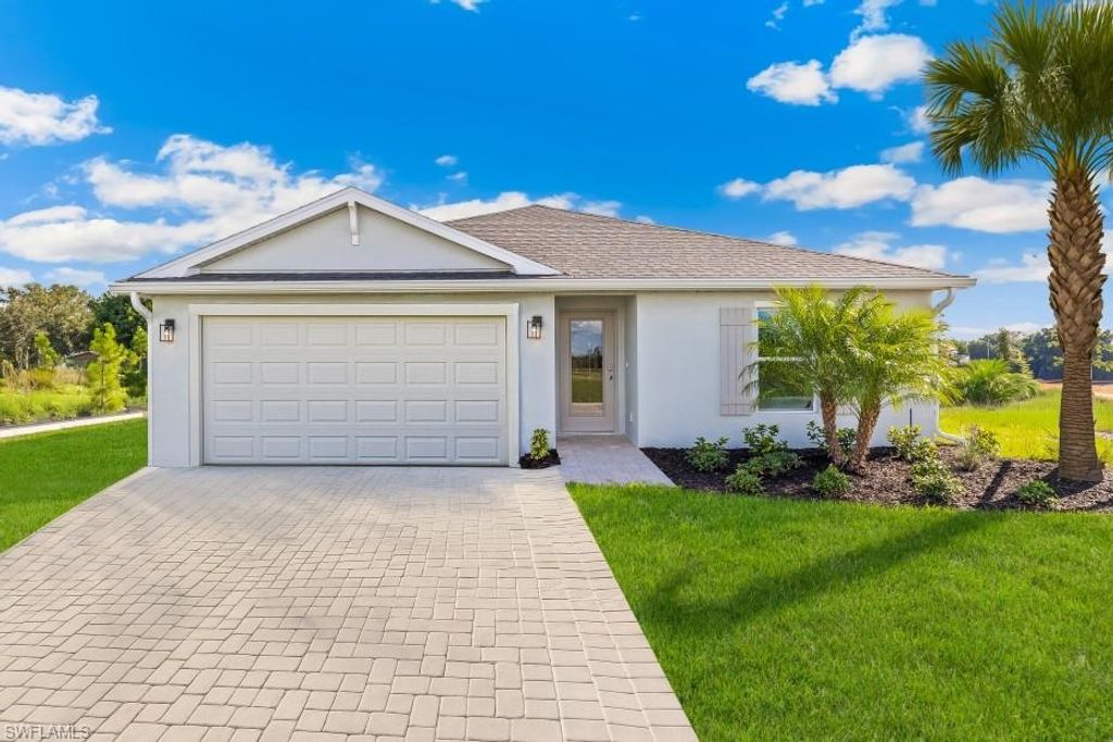 Photo of 727 NEWHALL ST E, LEHIGH ACRES, FL 33971 (MLS # 226016932)