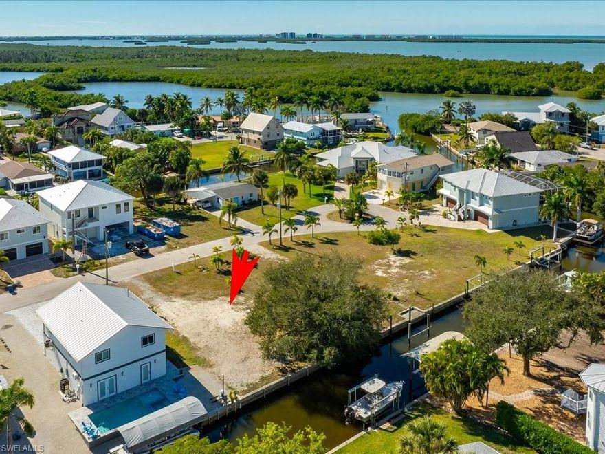 Opportunity awaits! A boater’s dream, offering Direct Gulf access and an exceptional opportunity to build a custom waterfront home. This  cleared vacant residential lot already seawalled provides a blank canvas to design a residence tailored to your vision, with boating and water access as the true centerpiece. Can build up to 35'.  NO HOA FEES! NO RENTAL RESTRICTIONS! No Special assessments!

Surrounded by a mix of established residences and newer construction homes, the neighborhood reflects both stability and growth. Enjoy quick, convenient access to the Gulf of Mexico—ideal for boating, fishing, and embracing the Southwest Florida waterfront lifestyle.
Perfectly positioned just minutes from the luxury amenities of the Hyatt Coconut Point and Ritz-Carlton Residences Estero Bay, the location offers the best of coastal living with close proximity to world-class dining, beaches, and resorts. Lots of growth in this neighborhood and expected appreciation. 

With no existing structures, you have the flexibility to choose your builder and build on your own timeline (subject to local zoning and building requirements). Whether you envision a primary residence, seasonal retreat, or investment property, this lot represents a rare opportunity to create a waterfront home in a highly desirable Gulf-access setting.