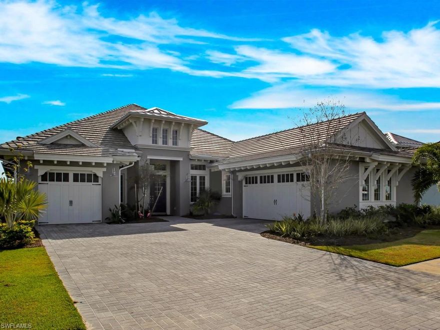 NEW 2017 Copperlilly one story home located on PRIME bedazzling LAKE facing South. Over $300,000 in upgrades! Exceptional designer color pallet of light grey contrasted with crisp white trim. Its fresh, classy and exactly what today's buyer wants. Fabulous oversized island kitchen that seats 6. Highest grade wooden cabinets with soft close, walk in pantry and extended counter space. Sunny and bright with sliding doors that disappear into the wall. The flex room is perfect as study/ Media room. Two guest suites both with private full bath and walk-in closets. Outside area is the BEST with Bar, Gas Grill, Refrigerator, and big screen TV. Enjoy the view from picture frame screen enclosure, lounge on SUN SHELF in the pool. Rinse off from outside shower, change in pool bath. Master suite with plush carpet, elegant master bath and his and her's walk in closets. The 3 TV'S are included and furniture is a possibility.  Two car garage and one car garage for a total of three. The Isles Lifestyle has won several awards for one of Naples most outstanding communities. Fitness center, tennis, pickle ball, kayaking, bocce ball, biking, nature trails, Overlook restaurant & Cane Cove dog park.