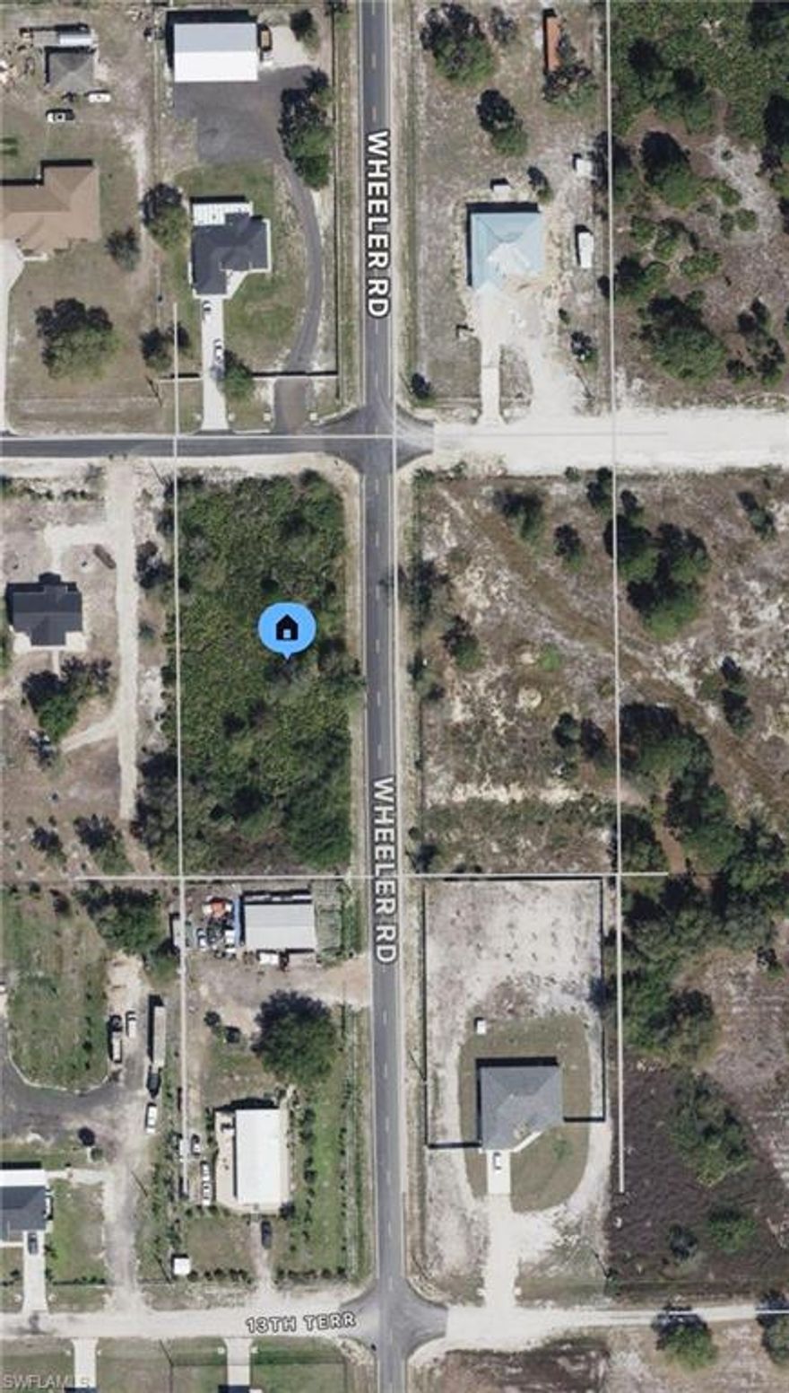 Paved road on corner lot! Southern exposure. 1.25 acre lot in Labelle’s exclusive Wheeler Estates Subdivision. Large new construction homes all around. Financing available! Hablo Español!