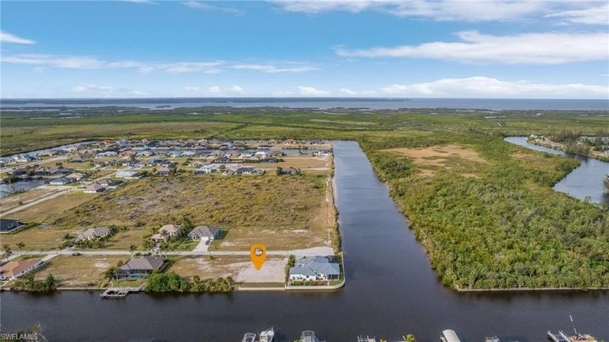 Prime Gulf Access Waterfront Lot! NO BRIDGES!! SEAWALL IS ALREADY IN PLACE! Build your dream home on this boater’s paradise, featuring direct access to the Gulf with no bridges. This waterfront lot offers breathtaking canal views, plenty of space for a custom dock and lift, and is located in a desirable area surrounded by beautiful waterfront homes. Enjoy the Florida lifestyle with easy access to world-class fishing, boating, and white sandy beaches. Close to dining, shopping, and entertainment, this is the perfect opportunity to own a slice of paradise! Don’t miss out— start living the waterfront lifestyle today!