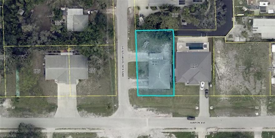 Corner lot duplex with canal access.  This property is located West of US 41, less than a mile to Bonita Beach, restaurants, and shopping.  Great investment property opportunity.  This property was flooded by Ian and has been gutted and is being sold AS-IS.