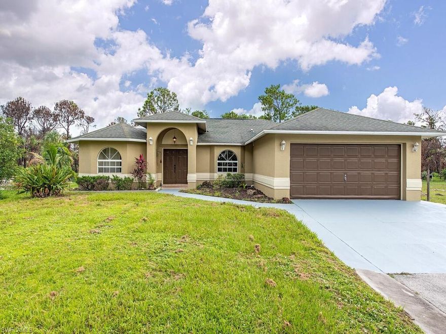 H2988 - Welcome to Golden Gate Estates.  Charming home with open concept, new kitchen appliances, new vinyl flooring and manual storm shutters on over an acre of land!