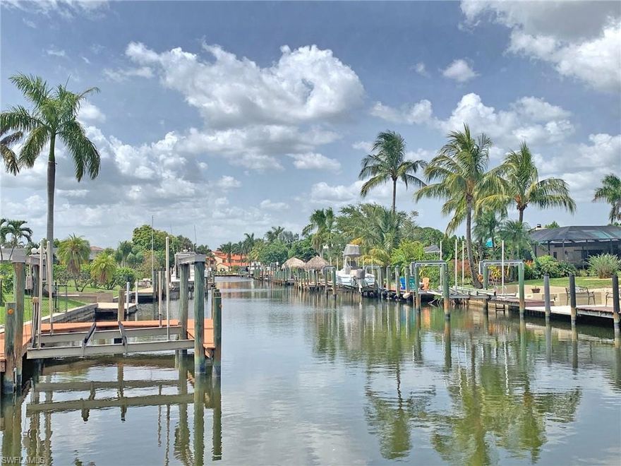 Boaters Paradise! Don´t miss the Video Tour - Large corner lot by the canal with Gulf Access. TURN-KEY - 3 bedroom + Den/2 bath home with a large pool and pool area, the Den is used as a 4th bedroom. This wonderful home features every Florida lifestyle essential and has Eastern exposure. Large electric heated pool and pool area with a 
Brand-new pool cage 2018, New Quartz counter tops and stainless-steel appliances 2018, New A/C–2019, New Duct work–2019, New Roof 2018, New 10,000 lbs. boat-lift with a wraparound dock 2017, New Hot Water Heater 2020, New washer 2020. Nothing more to do here! 

Primary/ Master bath features a tiled shower and with a walk-in closet. Enjoy relaxing or swimming in your pool with a view over canal. A few more steps and enjoy fishing from your own dock.This convenient SE Cape Coral home has only 15 min by boat to the Caloosahatchee River/The Gulf of Mexico. 

Only minutes to downtown to Cape Coral and to Cape Coral Yacht Club Beach. Quick access to the bridges to Fort Myers. 25 min to South West Florida International Airport This well kept home is ideal for someone looking for it all without busting the budget!