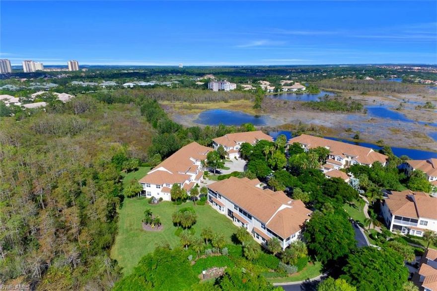 This exclusive Cypress Island second floor end-unit features a freshly renovated kitchen and master bath, new AC and duct work, an abundance of natural light, and majestic views of pristine Cypress preserve.  Open floor plan with split bedrooms, loft, den, breakfast nook, and private lanai gracefully revolves around oversized great room and central kitchen with a tremendous sense of warmth and effortless luxury.  Across the bridge, located in the heart of Pelican Landing, Cypress Island residents enjoy a private resort-style swimming facility with spa and decorative waterfall, private clubhouse with billiards table, grills, and sheltered gathering area, and one of the most diverse collections of natural ecosystems and wildlife the region has to offer. This home includes membership to Pelican Landing and access to its many world class amenities including a private island beach club, 12 Har-Tru tennis courts, pickleball, sailing club, and Gulf-access boating. Golfers, please inquire about private membership options at member-owned Pelican’s Nest: 36 holes of championship golf designed by renowned golf course architect Tom Fazio.