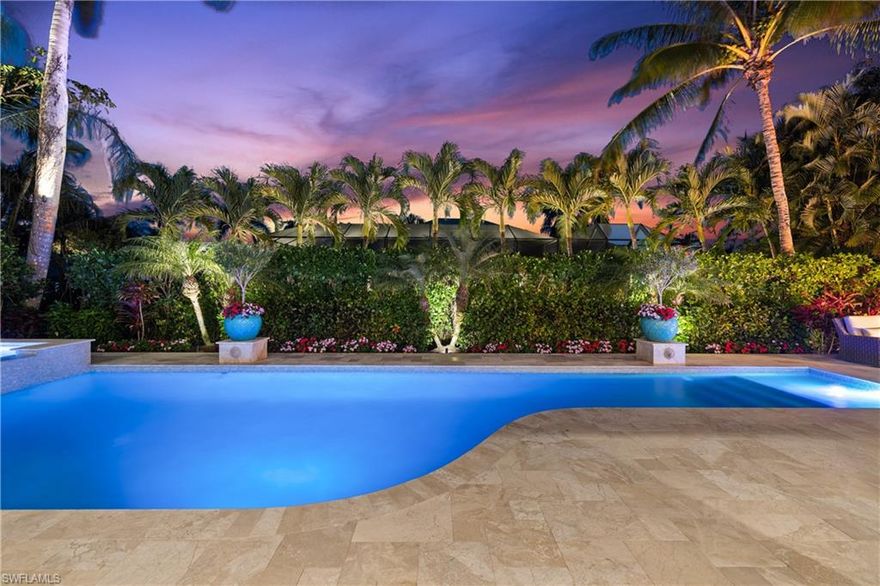 Presenting a truly exceptional custom-built estate in the prestigious Park Shore neighborhood of Naples, Florida. Designed with unparalleled craftsmanship and attention to detail, this award-winning masterpiece blends sophistication, comfort, and a prime location into one extraordinary offering. As you arrive, the home's elegant facade is framed by extensive mature landscaping, setting the stage for the grandeur within. The stunning mahogany front entrance doors open to a light-filled interior with soaring cathedral ceilings, white oak flooring throughout, and a striking fireplace anchoring the living space. The chef's kitchen is a statement in luxury, featuring dual islands, handcrafted Ruffino cabinetry, Calcite quartzite countertops, and top-tier Wolf, Sub-Zero, and Miele appliances. A walk-in pantry and a butler's pantry--complete with a second dishwasher and wine cooler--offer both convenience and refined entertaining options. Designed for both relaxation and hosting, the home boasts an exceptional outdoor living space with total backyard privacy. The south-facing saltwater pool and infinity-edge spa are bathed in sunlight all day, complemented by tranquil fountains, a marble pool deck, and a sun shelf for lounging. The outdoor kitchen, gas fire pit patio, and lanai with a fire pit table create a seamless indoor-outdoor lifestyle, perfect for entertaining under the Naples sky. Thoughtfully designed for guests and residents alike, the first level features a primary wing with spacious closets and a spa-like primary bath, a private guest suite with an en-suite bath, and an office space with custom built-in cabinetry. The second-level VIP suite offers an expansive retreat with an oversized, opulent bathroom, a private balcony, and a loft for added versatility. Perfectly positioned near Naples' renowned beaches, fine dining, and upscale shopping, this exquisite residence delivers the ultimate in luxury and lifestyle--a rare opportunity to own a truly one-of-a-kind home in one of Naples' most sought-after locations. Experience the essence of Park Shore living--schedule your private tour today.