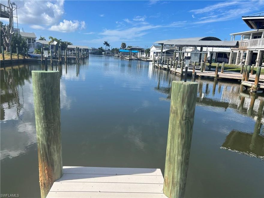 Excellent York Rd vacant lot location. Composite dock and 12,000lb boat lift. View down the entire canal facing west for the ultimate sunset views. Lot has been cleared and contains a storage shed. Major savings on impact fees! Deep water canal will take you to the outer islands and Gulf of Mexico in a matter of minutes!  Enjoy the best fishing, beaches in SW Florida. Island living at it's best!!