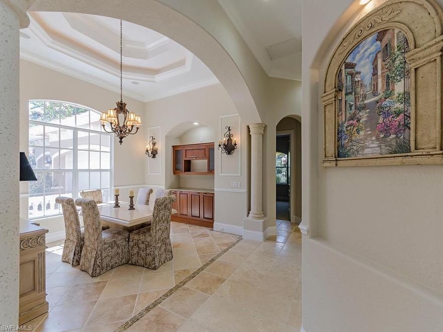 H.11737 - A Residence Truly Like No Other; A Masterpiece In The Strand.  Premium Corner Lot With Wrap Around 180 Degree Lake & Golf Course Views.  This Estate Home Is In Pristine Condition And Professionally Painted Both Interior And Exterior.  Craftsmanship Of Solid Core Doors, Incredible Double Tray Crown Moldings, Coffered Ceilings Plus Architectural Details Throughout.  Beautiful Gourmet Kitchen Has Unique (Solar Cap) Tubular Ceiling Lighting, Italian Glazed Cabinetry, Granite Countertops, Wall Oven And Stainless Steel Top Of The Line Appliances And Built-In Wine Bar With Refrigerator. Luxurious Master Suite Has French Doors, 2 Walk-In Closets, Raised Jetted Tub And Marble Flooring & Vanities.  There Is A Separate Private Wing For A Guest Suite Including A Large Balcony.  The 2 Story “Picture Framed” Pool Cage Covers The Expansive Outdoor Living Area Including Summer Kitchen With Outdoor TV.  Spacious Oversized 3 Car Garage With Extra Storage.  Whole House Storm Protection & 3 AC Units.  A Great Value With Almost 4,000 Square Feet Under Air And Totaling Almost 6,000 Under Roof.