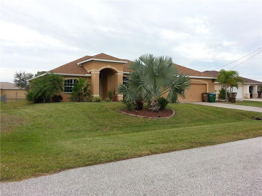 Nicely DETAILED, in a quiet area of NW Cape Coral,  large three bedroom two bath with the open den, HIGH TREY CEILINGS in the master bedroom and great room, large master bathroom with separate tub and shower. double entry doors, crown moldings,  fenced yard, oversize garage with work bench, Large screen patio with siding pocket doors. City of Cape Coral proposed utility expansion estimates arrival to this area in 2019-2021; any costs associated with this program are the sole responsibility of buyer.