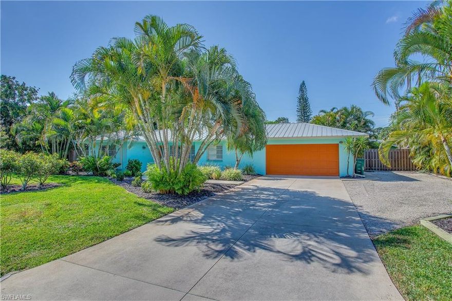 Come be a part of the Naples Cottage lifestyle!  This adorable and well maintained 2 bedroom plus den home features a two car garage, new flooring, newer metal roof, updated kitchen and plantation shutters.  Situated on a full lot and a half, you can enjoy the private pool and screened lanai from the fully fenced backyard.  Located minutes from Waterside shops and Sea Gate beach, you can be tucked quietly in the middle of town for under $400K.  A must see!