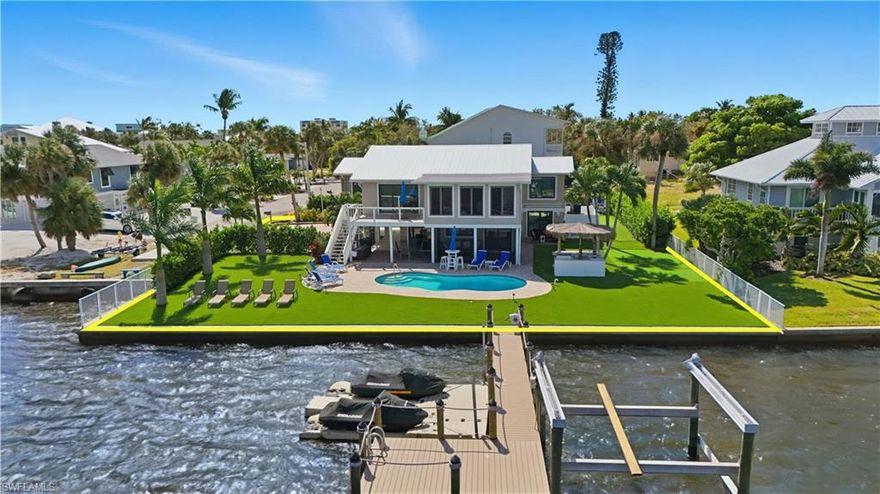 Nestled on a tranquil bayfront setting, 205 Bayview Avenue offers the perfect balance between private coastal living and investment opportunity. Designed for a blended lifestyle, this stunning residence is ideal as a second home, a weekend retreat, or an income-producing property—all just steps from the beach.



Completely remodeled both upstairs and downstairs, the home showcases three spacious bedrooms plus a den and three full bathrooms. The lower level features a kitchenette, providing flexible guest or rental accommodations, while the upper level reveals a chef’s kitchen and full bar, seamlessly blending comfort and entertainment. Oversized windows frame breathtaking bay views, where dolphins and coastal birds glide through serene waters—your daily backdrop to life in paradise.



Perfectly positioned on a direct beach access road, this home is tucked away yet convenient, just one block north of Publix and within minutes of mid-island dining, shopping, and the vibrant Fort Myers Beach community. Enjoy mild Florida winters, endless beach walks, and captivating sunsets, all from your own waterfront sanctuary.