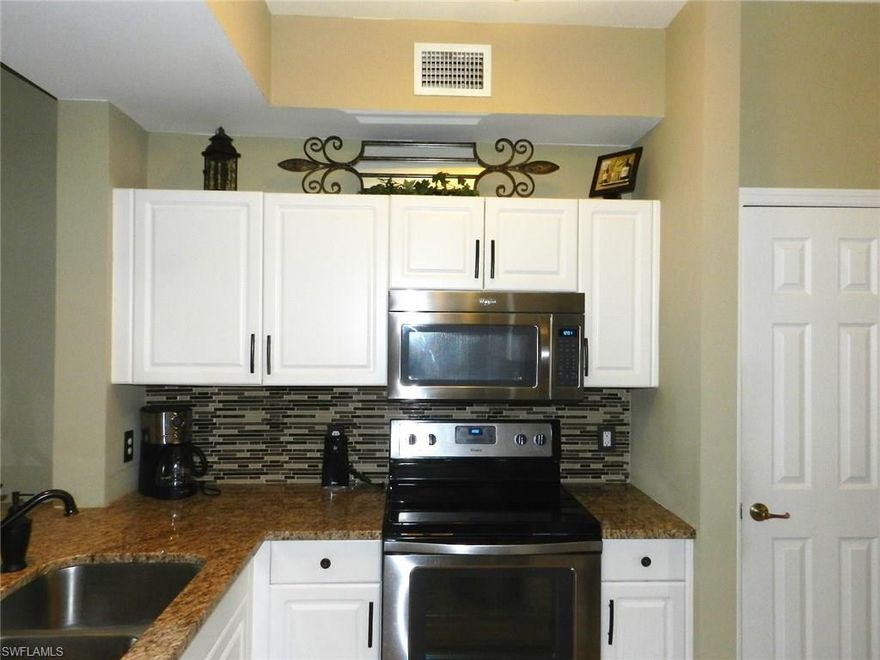 Spectacular, Turn key furnished 2 bedroom, 2 bath condo in Legends Country Club that has been completely updated and ready for the next owner. Here are some notable features. Tiled and glassed lanai with a wonderful lake and golf view, big 20" tile on the diagonal in all living areas, wood floor in two bedrooms, granite in kitchen with breakfast bar, brand new stainless steel appliances, fresh paint, new lighting fixtures, glass shower door and much, much more. This property comes with a Social membership and is located close to the community pool.