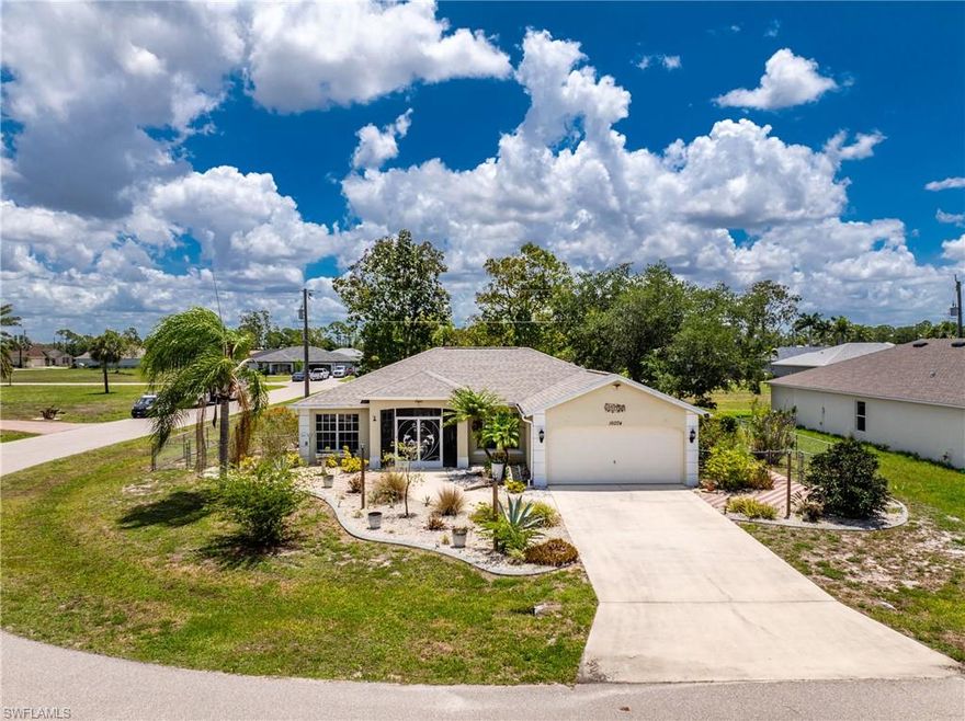 Welcome to 16074 Overdale Court, a lovingly maintained 3-bedroom, 2-bath, 2-car garage home set on a desirable corner lot in the Deed-Restricted community of Burnt Store Village. Residents here enjoy a community park with gazebo, playground, and a scenic walking trail around the lake and public water and sewer. This home features a FULLY RENOVATED KITCHEN, a newer 2021 ROOF, a NEW 2025 AC SYSTEM, a new 2025 DRYER and DISHWASHER. NO FLOOD INSURANCE IS REQUIRED. The heart of this home is the stunning kitchen, beautifully renovated in spring of 2023. Gorgeous quartz countertops, an oversized farmhouse sink, a large breakfast bar with underlighting, glass display cabinets, display shelves with uplighting, and an abundance of storage make this a chef's dream and a natural gathering place for family and friends. The adjacent dining room features attractive window treatments. The spacious great room is sure to impress with its high ceilings, a wall-mounted flat screen TV, and lovely views of the backyard, where a beautiful oak tree provides natural shade. Sliding glass doors open to the generous 10' × 25' tiled screened lanai — perfect for enjoying Florida's outdoor lifestyle — and an additional open patio beyond. The fully fenced yard is perfect for your pup. SOLD MOSTLY FURNISHED with some exclusions, this home's designer coastal color palette, modern dark bronze fans and fixtures, and tile flooring throughout the main living areas give the interior a polished, cohesive feel. The smart split-bedroom floor plan ensures privacy for everyone. The primary suite is generously sized with an accent wall, windows on two sides, a seating area, walk-in closet, and linen closet. The ensuite bath features a single vanity with a dedicated dressing table. The guest wing is accessed through a modern barn door — ideal for morning privacy — and includes two spacious bedrooms, each comfortably accommodating queen beds with bifold door closets. The guest bath offers a tub/shower combination with sliding glass door and single vanity. Step outside and enjoy the curb appeal: a wide paver entry sidewalk, curated plantings, concrete-curbed flower beds with stone mulch, and a paver patio. The screened front entry leads to a welcoming foyer with a coat closet and a handy alcove for hats and leashes. The laundry room off the kitchen offers great space and storage shelving. Peace of mind comes standard — this home has full hurricane protection on all windows and doors, including impact sliding glass doors and an impact-rated front entry door. Major updates include a new roof (2021), full kitchen renovation (2023), new refrigerator (2023), new A/C (winter 2025), new dishwasher (2025), and new dryer (2025). Low utility bills round out the picture. This is Florida living at its finest — move-in ready, thoughtfully updated, and priced to sell.