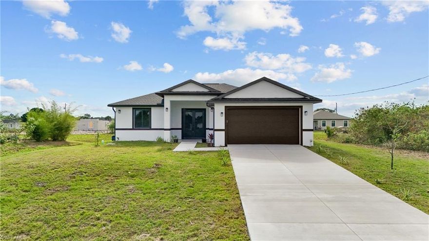 MOVE-IN READY new construction in LaBelle offering MODERN design and upgraded finishes throughout. This 2025-built home features 1,558 sq ft under air with 3 Bedrooms, 2 Bathrooms, and a desirable split-bedroom floor plan for added privacy.

Situated on an oversized 0.26-acre lot, this property provides more space than typical homes in the area. IMPORTANT INFO: Property is on City Water & Septic, Not in a Flood Zone & Not in an HOA.

 Inside, you’ll find laminate flooring throughout, tray ceilings in the living room, and a bright open layout centered around a spacious kitchen island. The kitchen is equipped with quartz countertops, real wood soft-close cabinetry, and stainless-steel appliances.

The primary suite includes a large custom walk-in closet and a well-appointed bathroom with dual vanities. The guest bathroom features a sleek walk-in shower with glass doors. Additional highlights include Impact Windows and Doors, Washer and Dryer included, and a 2-Car Garage with Epoxy Flooring.

Enjoy outdoor living with a custom pergola, perfect for relaxing or entertaining. Seller is providing option to paint at no extra cost to Buyer (choose you preferred color).

Schedule your showing today.