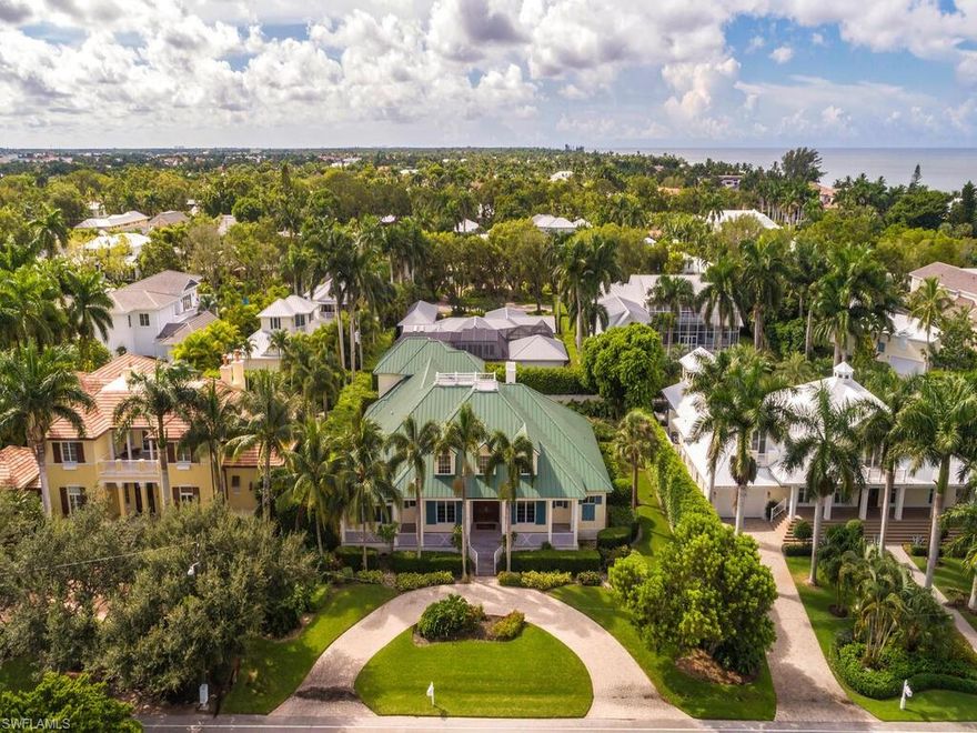 Situated only four houses from Naples’ sugar sand beaches on an 129’ x 149’ parcel, this home represents a quintessential tropical retreat.
