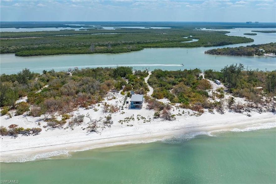 Tropical waterfront escape on Keewaydin Island, two bedrooms and one bath. Discover your slice of paradise on Keewaydin Island with this stunning, new two-bedroom, one-bath beachfront home. On 1.8 acres of pristine land, this rare property offers a peaceful retreat just minutes by boat from Naples Bay and Marco Island yet feels like a world away. Set along the Intracoastal Waterway, the home includes a private dock, providing easy and direct boat access. Whether you're arriving for a weekend getaway or a longer island stay, getting here is a breeze. This property boasts expansive Gulf-frontage with pure white sugar sand beaches stretching out from your doorstep. Enjoy the tranquil sound of waves and unmatched sunset views from your backyard on the Gulf of Mexico. This state-of-the-art beach house is designed with sustainability in mind. Fully off-grid, it runs on advanced solar energy systems with a backup generator, so you can enjoy all modern comforts while living in harmony with nature. The home blends laid-back island charm with cutting-edge contemporary features. Whether you're lounging indoors or relaxing on the expansive deck, every detail is crafted to maximize the stunning surroundings and provide effortless comfort. With its combination of seclusion, convenience and eco-conscious design, this Keewaydin Island home is the ultimate tropical escape.