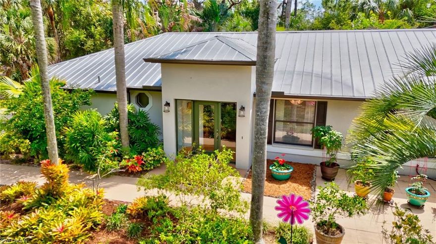 Situated on an expansive 2.27-acre homesite in Golden Gate Estates, this property offers the perfect blend of privacy, space, and modern comfort. Surrounded by mature landscaping and serene wooded views, the setting creates a peaceful retreat while still being conveniently located. Inside, the home features a spacious and functional layout designed for both everyday living and entertaining. The kitchen is equipped with a breakfast bar that flows seamlessly into a formal dining room, creating an inviting space for gatherings. Natural light pours into the massive secondary living area/family room, enhancing the open feel and providing a bright, welcoming atmosphere.
The primary suite is a true standout, featuring a completely renovated ensuite bathroom with custom tilework and high-end finishes, delivering a spa-like experience at home.

Step outside to the screened-in lanai, where you can relax and enjoy tranquil views of the private wooded backdrop which is perfect for morning coffee or evening unwinding.

Additional highlights include a whole-home reverse osmosis (RO) water system already installed for added convenience and peace of mind, and new gutters. 

This property offers the rare opportunity to enjoy acreage living with upgraded interiors, abundant natural light, and ultimate privacy in one of Naples’ most desirable estate areas.