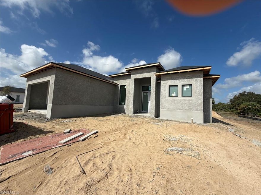 NEW CONSTRUCTION .......BEAUTIFUL 3 BED + DEN , 2 BATH AND 2 CAR GARAGE SITS ON 2.27 ACRES LOT........THIS BRAND NEW HOME ALSO FEATURES A BRIGHT & OPEN FORMAL LIVING & DINING ROOM,IMPACT WINDOW,GRANITE COUNTER TOPS, STAINLESS STEEL APPLIANCES, TILE FLOOR WITH SPLIT BEDROOM, WALK-IN CLOSET IN MASTER BEDROOM, TRAY CEILING, AUTOMATIC IRRIGATION SYSTEM , ASPHALT DRIVEWAY ,AND MORE....BRING YOUR FAMILY AND YOUR PETS AND MAKE THIS HOME AN AWESOME PLACE TO LIVE . VERY PRIVATE AND CONVENIENTLY LOCATED NEAR SCHOOLS AND SHOPPING CENTERS.HOUSE WILL BE READY IN 30 DAYS.