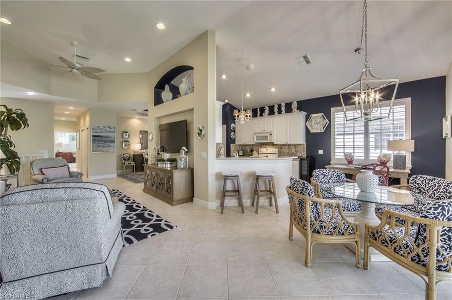 Spacious 2nd floor condo Osprey model in Morningside with fabulous views from lanai overlooking the 12th green of the south course, as well as, views of two lakes at Shadow Wood Country Club. Floor plan features 3 bedrooms or (2 bedrooms+media room or office), 2 baths, and an attached garage. Up-to-date color palette and style. Great room has tile on the diagonal, art niches, and a flat screen TV. New chandelier is enhanced by tray ceiling in dining room. Kitchen has solid surface counter tops, pantry, breakfast bar and morning room. Double doors open to the master bedroom featuring volume ceilings, sliders to the porch, large walk-in closet, and en-suite bath with dual sinks, separate tub and shower. Morningside has its own private pool and spa, fitness center, and meeting room. Membership opportunities available at Shadow Wood Country Club with 54 holes of private golf, bocce, tennis and social activities. Membership to the Commons Club comes complete with fitness center, full spa, beach club, pickle ball, private restaurant and enrichment center. Conveniently located close to RSW airport, shopping, restaurants and beaches.