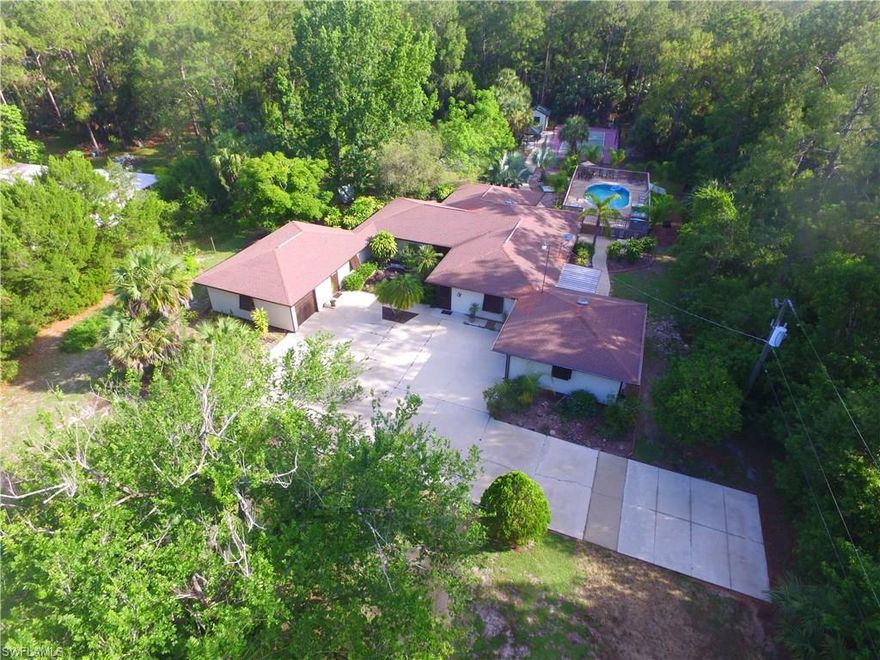 A true "Hidden Gem" This secluded & tucked away private residence its just amazing!! Close to everything Naples has to offer. Less than 1 mile from 951(Collier Blvd) 5 minutes away from I-75 exit 101. Property features a Brand New Roof & 2 New AC units & Water System. It has an attached 24'x24' Office Suite (Not Pictured). The above ground Pool/Spa are set within a Huge elevated wood deck (52'x24'), For the sports fanatics, there is a (70'x34') "Lighted" Sports court w/Duragrid flooring to enjoy "Pickle-ball, shuffleboard, hopscotch, basketball, hockey, golf, short-court tennis, volleyball & the list goes on. All this sitting behind a winding driveway on your own private 2.73 acres retreat. There are ceiling fans in every room. Property has 2 Master Bedrooms. RV Plug-in station w/ 50,30,15 Amps connections. Bahama Storm Shutters all around. 1000lb hoist in main Garage. Whole house exhaust fan. You must come see this beautiful property to really appreciate all it has to offer. Sellers are waiting for your offer.