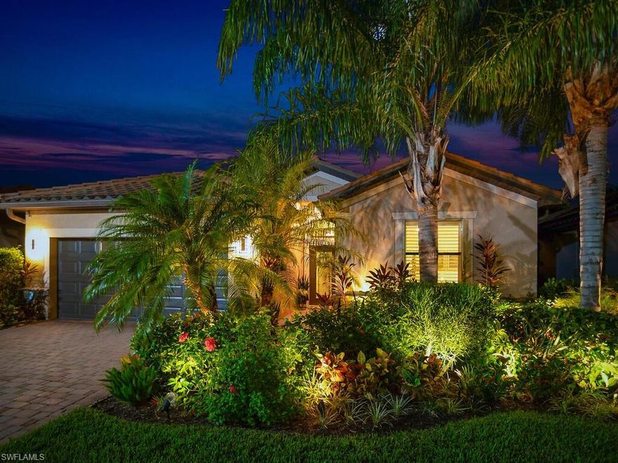 Welcome to Reflection Isles, where this stunning former model home offers the perfect blend of elegance and comfort. From the moment you step inside, you’ll feel the warmth and charm of this beautifully designed Trevi floor plan, featuring 3 bedrooms, 3 full baths, a DEN, and an oversized 2-car garage. Designed with relaxation and entertaining in mind, this home is a private oasis with a sparkling pool, spill-over spa, custom lanai lighting, and privacy blinds that frame serene lake and natural preserve views. The covered lanai is the ideal place to unwind, whether soaking up the sun by day or enjoying a peaceful sunset by night. Inside, the open concept of living and dining spaces flow seamlessly into the kitchen, which is a chef’s dream. With upgraded stainless-steel appliances, granite countertops, a large center island, white cabinetry with undermount lighting, a reverse osmosis water filtration system, and a walk-in pantry, this kitchen is perfect for everyday meals and entertaining guests. The owner’s suite is a luxurious retreat with two walk-in closets and a spa-like bathroom that includes dual sinks, a separate tub, a large walk-in shower, and a private water closet. The second bedroom functions as a private ensuite, newly updated bathroom with a sleek new glass shower door, new modern tile work, new backsplash, new vanity, and new sink. The third bedroom, equally private and tastefully decorated, offers a comfortable haven for guests. A spacious hallway leads to the executive office/flex room, which is accessed through elegant double glass doors. Throughout the home, custom wall and trim work, wainscoting, beamed ceilings, wood panel accents, all tile resealed and large built-in dining room mirrors add a touch of sophistication. Designer window treatments and custom plantation shutters grace every room. The oversized, extended 2-car garage offers ample room for vehicles and storage, with additional storage units and ceiling racks. For added peace of mind, electric hurricane shutters protect the covered lanai and front entry. Lush tropical landscaping, including new gardens, hedging, and pebble borders, enhances the peaceful ambiance. Ideally located across from the amenity center, this home provides easy access to an updated fitness center, resort-style pool, playground, basketball, pickleball and tennis courts. Reflection Isles also offers low HOA fees, which cover cable and internet, irrigation water, professional landscaping, recreational facilities, and security-controlled community access. Conveniently close to shopping, dining, I-75, FGCU, SWFL International Airport, and beautiful local beaches, this home is truly a rare find. Don’t miss the opportunity to experience its beauty and value firsthand—this is a must-see!