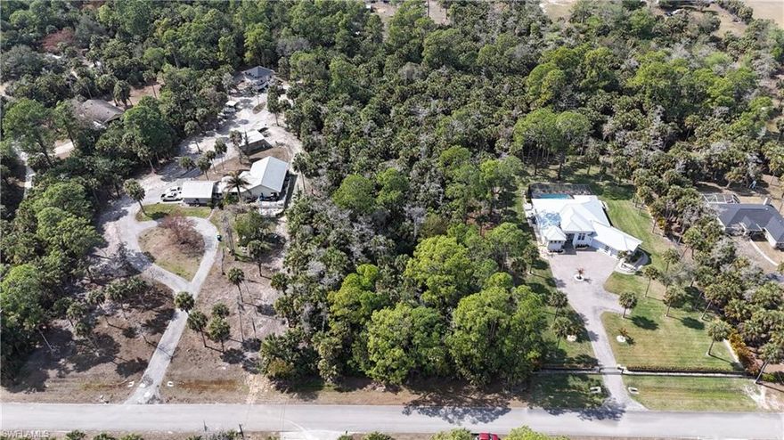 FANTASTIC and HIGHLY DESIRED AREA - CURRY ISLAND * MILLION DOLLAR + HOMES ON THIS STREET * UPLAND IN FRONT and BACK per 2026 ENVIRONMENTAL * SURROUNDED BY OVERSIZED LOTS - GREAT FOR PRIVACY *  CONTAINS SOME X and X500 FLOOD ZONE * GREAT SUNSETS FROM YOUR FUTURE BACK PORCH and POOL with THE BACK OF THIS LOT FACING WEST * ONE HOME and ONE GUEST COTTAGE and AG PURPOSES ALLOWED * Click on the two drone video / virtual tour links to see this gorgeous lot twice from different angles.