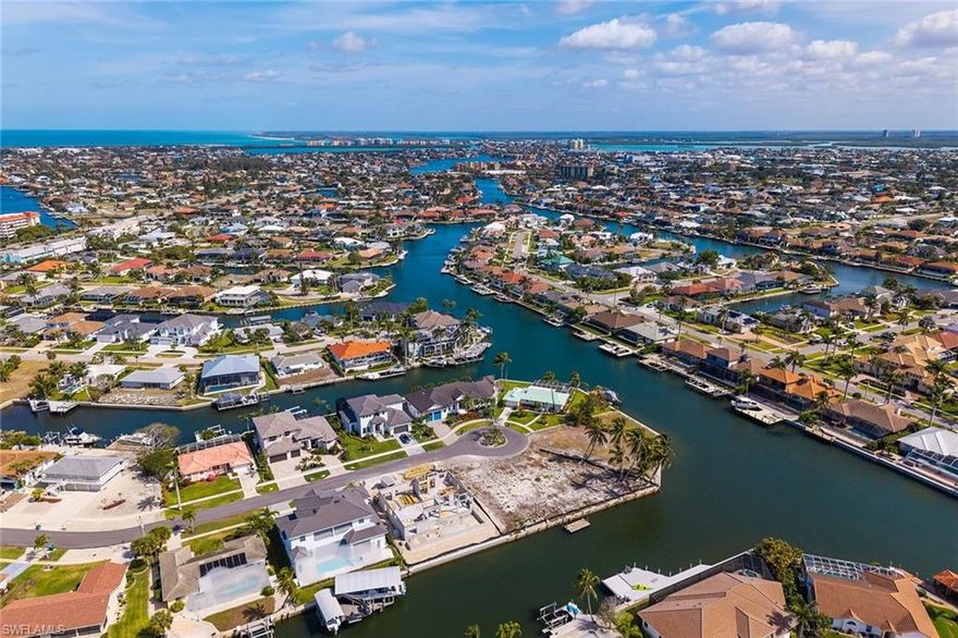 159 Feet of BRAND NEW SEAWALL included. Outstanding opportunity to build your dream home on this oversized waterfront lot in a prime Marco Island location! At the end of a quiet cul-de-sac, 839 Dandelion Court boasts quick access to the Gulf, only one high bridge away, making this property ideal for boating enthusiasts. Featuring the sought-after southern exposure, ideal for enjoying year-round Florida sunshine, this expansive lot provides ample space for a luxury residence, pool and outdoor living areas. Dandelion Court is one of the desirable spots on Marco Island, featuring some of the newest homes around. Just moments to Resident’s Beach and all Marco Island’s amenities, this homesite provides the ultimate in convenience and privacy. Don’t miss this rare chance to own a piece of paradise with exceptional water views and easy Gulf access.