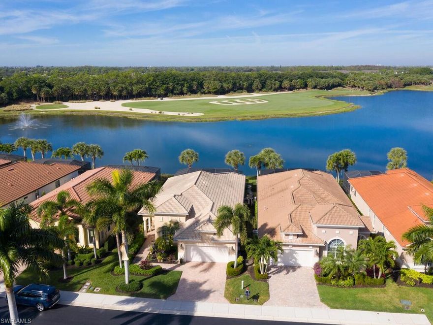 Spectacular lake & golf course view!  This renovated home in Porto Romano offers open-concept living with plank tile flooring, luxury outdoor space & access to world-class amenities at Miromar Lakes Beach & Golf Club!  Inside this 3 bedroom 2.5 bath single family home, you will find a comfortable layout with refined finishes & room to adapt. The primary suite opens directly to the screened lanai allowing effortless access to the saltwater pool & spa any time of day!  The primary bath offers dual sinks, soaking tub & walk-in shower.  One guest room can be closed off as a private suite - ideal for guests.  The third bedroom is currently a home office but can easily convert to accommodate guests.  The open kitchen flows into the dining area & living room, all with expansive views of the lake & golf course.  The kitchen has been fully renovated with beautiful counters & plenty of cabinetry featuring pull-out drawers & a large island that doubles as a breakfast bar with extra storage underneath.  With a gas range, built-in microwave & dishwasher, stainless refrigerator with 2 drawers, it is a Chef's dream. The spacious dining area is perfect for intimate dinners or entertaining friends & family.  Custom built-in's in the living area feature lighted display shelving, an electric fireplace & mounted TV.  The beautiful view of the lake & golf course can be enjoyed from the kitchen, dining - living room & primary suite.  The outdoor living area is fabulous with a gas-heated pool & spa for year-around enjoyment, outdoor kitchen that includes a built-in gas grill, beverage fridge, TV area & space to entertain.  The half-bath adds convenience.  Hurricane glass & electric hurricane screens on the lanai offer peace of mind.  Home also has whole house water purification system!  Residents will love the privacy & friendly neighborhood of Porto Romano!  Facing northwest for beautiful sunsets, this home offers low-maintenance luxury near top anchors Miromar Outlets, Gulf Coast Town Center & RSW - minutes away. Beaches & additional shopping, dining & entertainment venues are within close proximity. Miromar Lakes Beach & Golf Club offer over 700 acres freshwater lakes for your boating & waters sports, miles of sand beach with cabanas, clubhouse with indoor/outdoor dining & bars, private dining room, courtyard, library, billiard table & card room, Blue Water Beach Grill for open-air waterfront dining, resort-style pool & spa, full-service fitness center & spa, tennis, pickleball, putting green, marinas & fishing pier.  Golf memberships are optional for the Arthur-Hills-designed course.  Don't miss this rare opportunity for luxury resort-style living in this beautiful home waiting for you to call it home!