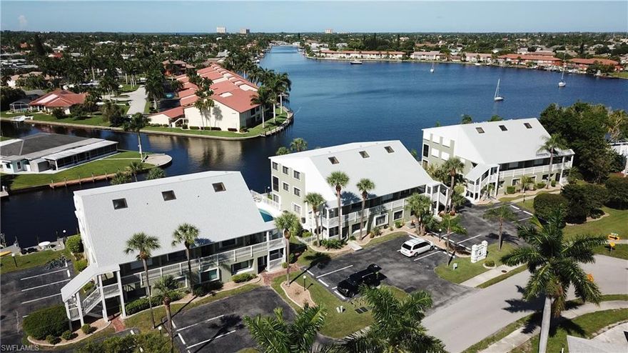 Here is your Chance!! REDUCED!!!!!! WOW You Get Breathtaking Direct Access Waterfront Admirals Walk Condo. Located right on the Bimini Basin.  A direct Sailboat Access Canal and so affordable. This spectacular loft condo has 2 spacious bedrooms and a den. Extra-large Living-room with views to die for. Imagine entertaining on your grand corner unit lanai and watching the Christmas Boat Parade or maybe the 4th of July Fireworks. This lovely condo overlooks the refreshing pool and Captains Walk where you can dock your 30 foot boat! The stunning condo also boasts according hurricane shutters. Just a 2-minute walk to the renowned Four Freedoms Park for recreation or pick-nick. You are located near all the amazing restaurants and nightlife that prominent Cape Coral offers. This home and all its spectacular features are only priced at only $159 a sq ft. Schedule your tour today before it is gone.