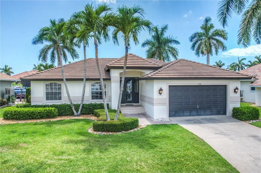 Yes!, you really can own a remodeled waterfront home on Marco Island at a price that won't break the bank. This island gem blends comfort, style, and the boating lifestyle buyers dream about. The kitchen and primary bath were beautifully remodeled by Ehlen Construction in 2009, while the roof was replaced in 2018 for added peace of mind. In 2011, the seawall was reinforced with 18 pilings and rip-rap, and an oversized dock with a 12,000-pound boat lift was added, ready for your next day on the water. Outside is where the magic happens. A sprawling pool and sun-soaked deck create the ultimate backyard retreat, complete with a built-in bar made for sunset cocktails, celebrations, and memories that last a lifetime. And with coveted western exposure, the sky puts on a show every single evening. Sold fully furnished, this home is ready for immediate enjoyment. Inside, the open great room design keeps everyone connected, whether cooking dinner, watching the game, working remotely, or hosting friends and family. The primary bedroom closet is currently configured as a bunk room, offering a clever sleeping space for guests, kids, or grandkids, but can easily be converted back to a closet. Waterfront living, sunset views, boating access, and move-in-ready comfort, all wrapped into one exceptional Marco Island opportunity.