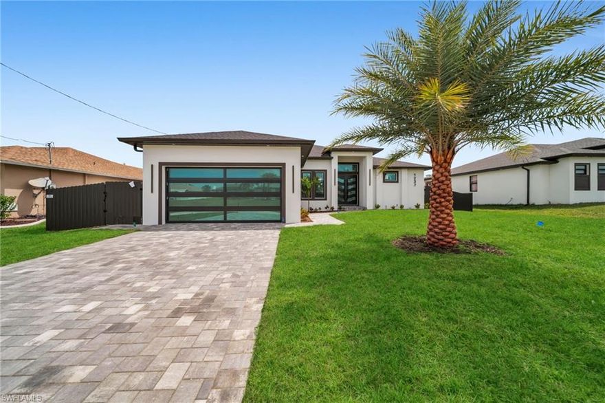 Step into modern Florida luxury in this brand-new 2026-built Sapphire model, offering 1,910 sq ft of refined living, 3 bedrooms + Den and 3 baths with a sleek, contemporary feel throughout. An expansive great room with soaring tray ceilings, full-home polished porcelain “marble” tile, and a dramatic wood-slat feature wall with book-matched slab detail creates a stunning first impression. The chef’s kitchen is the heart of the home, showcasing a large waterfall island, white shaker cabinetry, quartz counters and backsplash, walk-in pantry, premium stainless appliances, and bold gold hardware illuminated by sculptural LED pendants. Corner and triple sliders stack completely to blend indoor and outdoor living, opening to a pavered lanai, outdoor kitchen with grill and fridge, and a sparkling pool for effortless entertaining. The split plan primary suite features a tray ceiling, generous walk-in closet, and spa-inspired bath with double vanities and an oversized walk-in shower, while guest rooms enjoy a stylish bath that doubles as a pool bath. Additional upgrades include impact-rated windows and doors built to 2023 Florida Building Code, tall interior doors, designer fans and lighting, dedicated laundry room, and an oversized 2-car garage, all in a clean, modern package that feels like a boutique resort the moment you walk in.