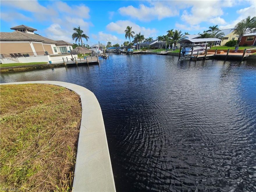 *** Rarely available oversized corner lot with approximately 235 feet water frontage and direct, unrestricted, super quick boat access to the river! *** A new seawall with 10 foot high (!!!) panels was installed in Nov. 2023 . *** Located in the prestigious Yacht Club Area in SE Cape Coral, only minutes away from Cape Coral Beach. *** All city utilities are available at the property and paid in full. The lot is cleared and ready to go!