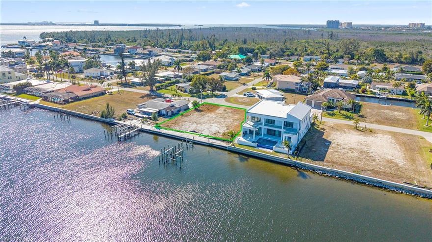 Exceptional oversized riverfront homesite offering 120 feet of direct Caloosahatchee River frontage with expansive, unobstructed open water views. Spanning approximately 0.38 acres, this premium property provides the ideal canvas to design and build a custom luxury waterfront residence. City water and assessments are paid in full with utilities in place, creating a seamless path to new construction. Perfectly positioned in Southwest Cape Coral near Tarpon Point Marina, waterfront dining, boutique shopping, and just minutes to Fort Myers via the Cape Coral Bridge. Surrounded by high-end riverfront estates, this location offers both privacy and convenience in one of the area’s most desirable waterfront corridors.