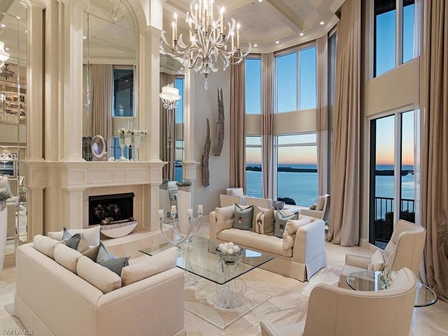 This magnificent 2-story open floor plan penthouse sits atop Palermo, an elegant tower at the Colony Golf & Bay Club. Designed by Kira Krümm Interior Design this fully furnished home with 5 bedrooms, 5.5 baths and over 7000 total SF, combines transitional and coastal styles, into a serene, chic and sophisticated masterpiece. Neutral backgrounds with color and texture reserved for the accents create a peaceful palette that frame the incredible views of the Gulf. The two story great room, featured on the cover of Florida Home and Design, is of a grand scale with a mirror-flanked fireplace, dazzling crystal chandelier and rich fabrics in creams and subtle blues. The Chef’s kitchen features a commercial gas range, 2 dishwashers and opens to a comfortable family room and breakfast area with custom banquette. A study and downstairs guest room completes this level. An open marble staircase brings you to the 2nd level with opulent master bedroom suite complete with private sitting area and spa type bath with steam shower and two additional guest rooms. This home features a private two-car garage with storage room. Colony amenities include Bay Club dining and boat access to private beach.