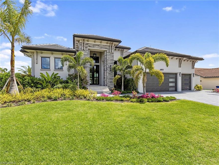 New waterfront luxury model home by Edge Water Development Group is now completed and available for immediate occupancy! Situated on a direct gulf access saltwater canal in prestigious Palmetto Point adjacent to Gulf Harbour Yacht and Country Club, this address is THE location, location, location of Fort Myers. By the numbers 95 linear feet of canal frontage, 65 ft yacht dock with shore power, living area of 3,470 sq ft, total area under roof is 5,114 sq ft, great room, 4 bedroom suites each with walk-in closets, 4 full baths, glass walled home office, powder room, pool bath, and 3-car garage with epoxy floors. This garage has 12.5 ft ceilings for your car lifts! Speaking of ceilings, wait until you see the exceptional custom coffered tray ceilings in EVERY room accented by exquisite lighting fixtures. Ceiling heights are 17 ft in the foyer, 14 ft in the office, 12 ft throughout, plus an additional 1-2 ft height inside the trays. Interior doors are 8 ft while exterior doors are 10 ft. This home exudes quality including what you can’t see behind the fit and finish such as spray foam insulation on the underside of the roof deck in the attic as well as sheet insulation behind the drywall on exterior concrete block walls. Extensive insulation, impact rated windows, and impact rated sliding glass doors create a quietness and energy efficiency you will appreciate. Edge Water Development Group fulfills certain visually important key trades in-house enabling them to provide attention to detail, perfection, and unsurpassed craftsmanship. Amish cabinetry, wood flooring throughout, and custom headboard walls! See photos and video for the primary bedroom, primary bath, kitchen, home office, pool, spa, expansive outdoor living area, outdoor fireplace, summer kitchen, laundry room, and technology mud room. Appliances include WOLF, SubZero, Bosch, and Generac. Natural gas powers the tankless water heater, five-burner gas cooktop, generator, and fireplace. YES, it has a fenced back yard. New luxury homes on the water in Fort Myers are nearly impossible to find, so call today!