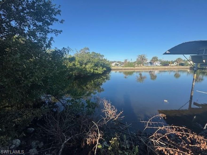 GULF ACCESS! This pie-shaped lot on a quiet cul-de-sac in Charlotte County offers 0.24 acres of prime waterfront property. Featuring an existing driveway and cement slab, this lot is zoned for a manufactured home and also meets county criteria for a single-family residence, giving you flexibility to build your dream home. Enjoy access to the Gulf, perfect for boating and fishing enthusiasts. Don't miss this incredible opportunity to own a piece of Florida paradise!