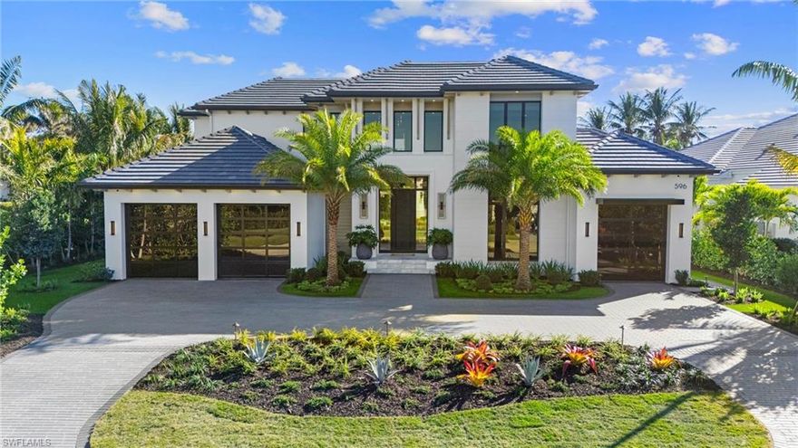 Welcome to this stunning 5,540 square foot estate, masterfully designed by R & Co. Designs and crafted by the renowned Borelli Construction—one of Naples’ premier luxury builders. Set on a large corner lot, this exceptional home offers five spacious bedrooms, five full baths, and two half baths.

Every detail of this home has been thoughtfully curated, from the elegant European wide plank French white oak flooring that flows seamlessly throughout, to the state-of-the-art Wolf and SubZero appliances in the chef’s kitchen. The open-concept layout features soaring ceilings, and oversized windows that flood the space with natural light while offering picturesque views of the meticulously landscaped grounds.

Located in one of Naples’ most sought-after neighborhoods, this one-of-a-kind residence combines timeless design with modern luxury, creating an unforgettable living experience.