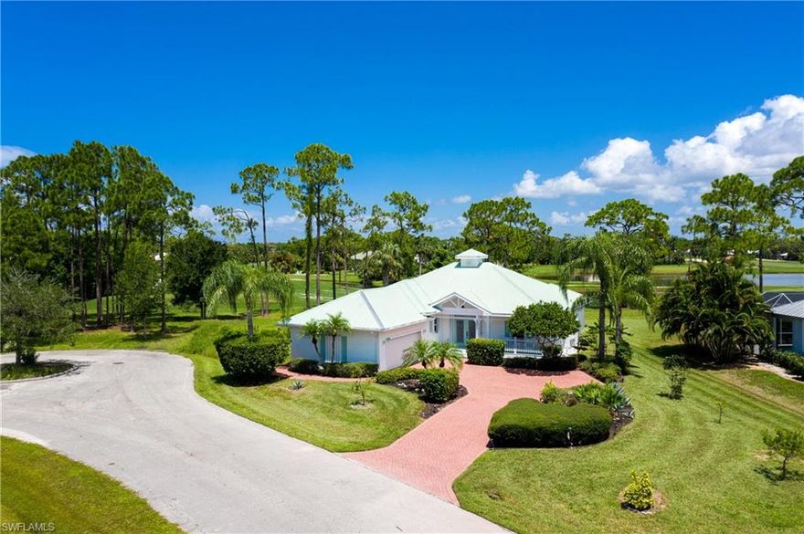 Coastal charm abounds from this Key West-style home situated on a picturesque lot overlooking the golf course! As you approach via the long paver driveway flanked with colorful exotic landscaping, you will be greeted by pleasing stained glass French doors & a classic covered front porch. Enjoy views of the pool & golf course backdrop through the back windows & French doors. Wood floors & a cheerful color palette lead you through the main living and dining space & provide a comfortable ambiance. The kitchen has been updated with white wood shaker cabinetry with attractive stone tops, tile backsplash, & storage space! The adjoining dining area enjoys splendid golf course & pond views making it the ideal locale to host fabulous dinner parties!  The master suite offers access to the lanai and boasts a walk-in closet, barn door to the tastefully updated bath with split wooden vanities with granite tops, & tiled Roman shower. The fabulous outdoor living space features an inviting undercover seating area, heated pool with soothing water feature & expansive paver deck. This home is being offered turnkey furnished – including a golf cart and offers storm shutters on all windows and doors!