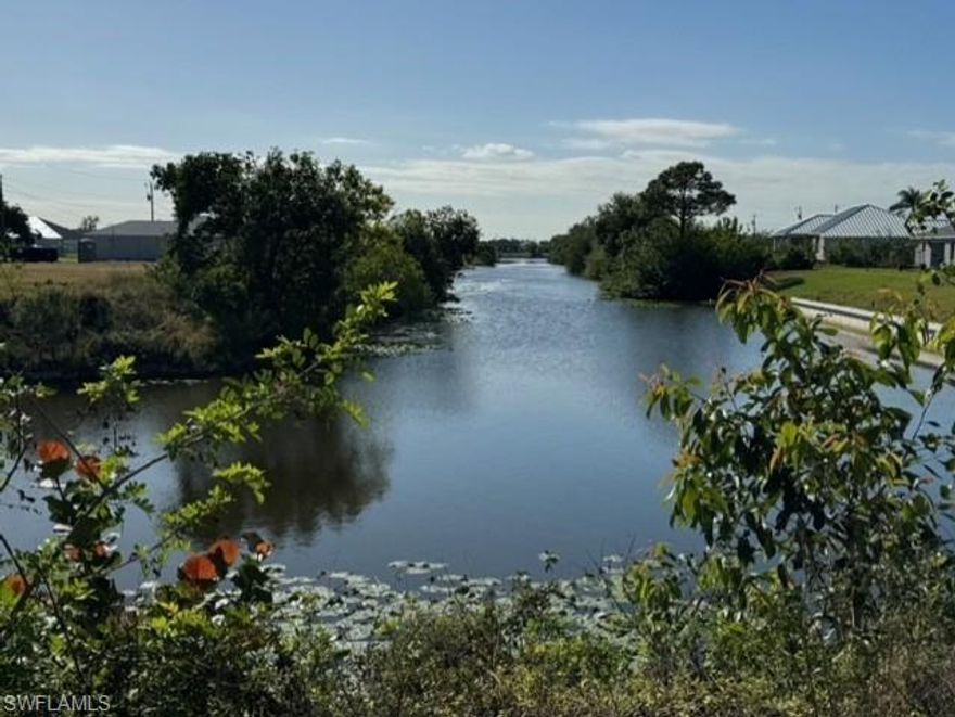 Rare opportunity for families wanting to live near each other or builders looking for convenience. Three waterfront lots next to each other are available. Sellers prefer to sell all three to a single buyer. The other two lots are 1024 NE 12th St and 1020 NE 12th St. Build your dream home on this southern exposure, wide freshwater canal lot in Northeast Cape Coral. This lot is located near many new homes and is close to Fort Myers and Punta Gorda so your entertainment options are endless. The lot is on the Bal Moral Canal with direct access to Lake Zurich for water enthusiasts. Nearby schools, shopping, dining and recreation make this an ideal location. Water, sewer and irrigation are already in place.