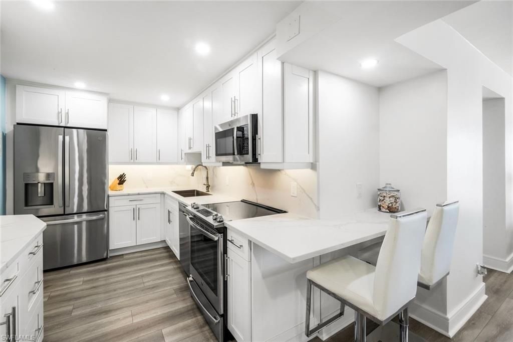 Photo of 4005 Gulf Shore BLVD N #404, NAPLES, FL 34103 (MLS # 225029388)