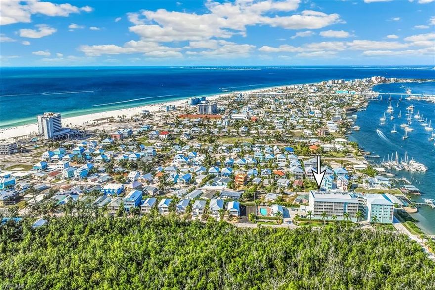FORT MYERS BEACH IS IN IT'S ASCENSION! This perfectly located Condo is just a little more than a 1/4 mile away from the GULF! Depending on your pace 5-8 minute walk! Views of the MATZANTAS BAY/PASS, BOATS, PARTIAL VIEW OF THE GULF FROM BALCONY, WOODED EASTERN SUNRISE VIEWS AND SUNSET EVERY NIGHT! Watch the KEY WEST FERRY from the new Dock and Pier. Beaches, restaurants, Grocery, Shopping and Fun all within driving minutes! Updated Kitchen and Baths. Newer HVAC and Water Heater. Electric Hurricane Shutters, Screened Balcony and Non-Screened Balcony. Clean and Efficient Elevator. THE best Garage Location in SEA GRAPE! Privacy you have to experience. Quiet when you want. Want to entertain? Pool is what you would draw up for Privacy and cleanliness .Billiards and Community House overlooking Pool. Private Dock and Pier at your fingertips. Firepit. Everything is here to enjoy SWFL BEACH LIVING! THIS IS YOUR FT. MYERS BEACH CONDO!