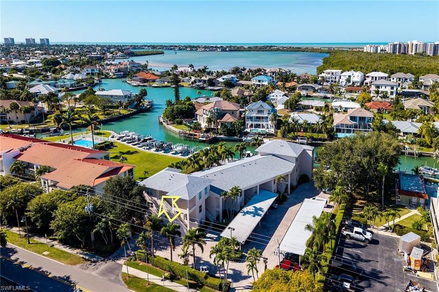 Arrive by boat and step into effortless island living with a deeded boat slip, lift, and direct Gulf access at this rarely available oversized one-bedroom waterfront residence in the heart of Olde Marco. Encompassing 905 square feet, this top-floor retreat offers exceptional privacy with no surrounding units and breathtaking southwest-facing water views. Thoughtfully offered furnished for immediate enjoyment, the residence also includes an assigned carport for added convenience. The impeccably maintained, well-managed association has recently completed substantial enhancements, including a new roof in late 2024 and an elegant cobblestone drive. A truly exceptional opportunity to own a private, low-density waterfront sanctuary in one of Marco Island’s most sought-after and historic enclaves.